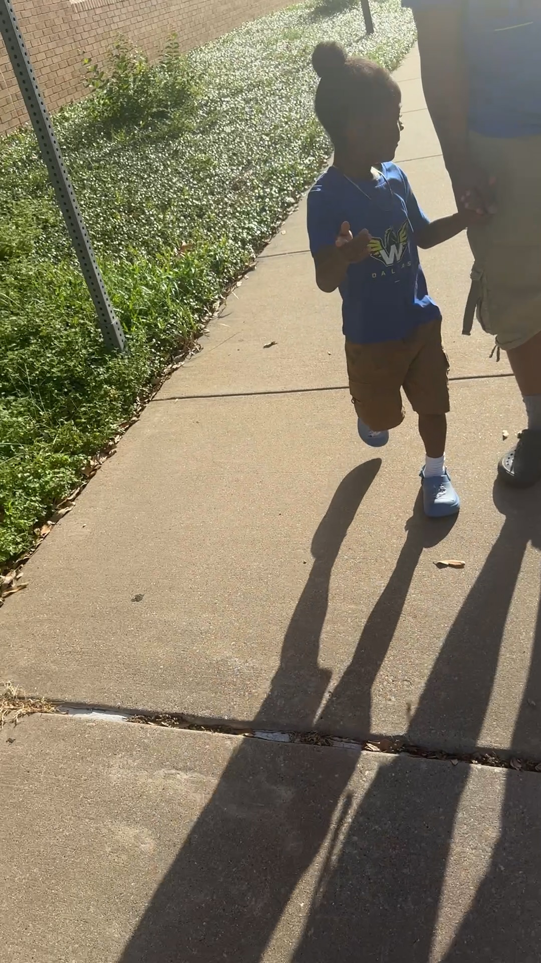 A young participant walking into the arena for a 4R Legacy community game day outing