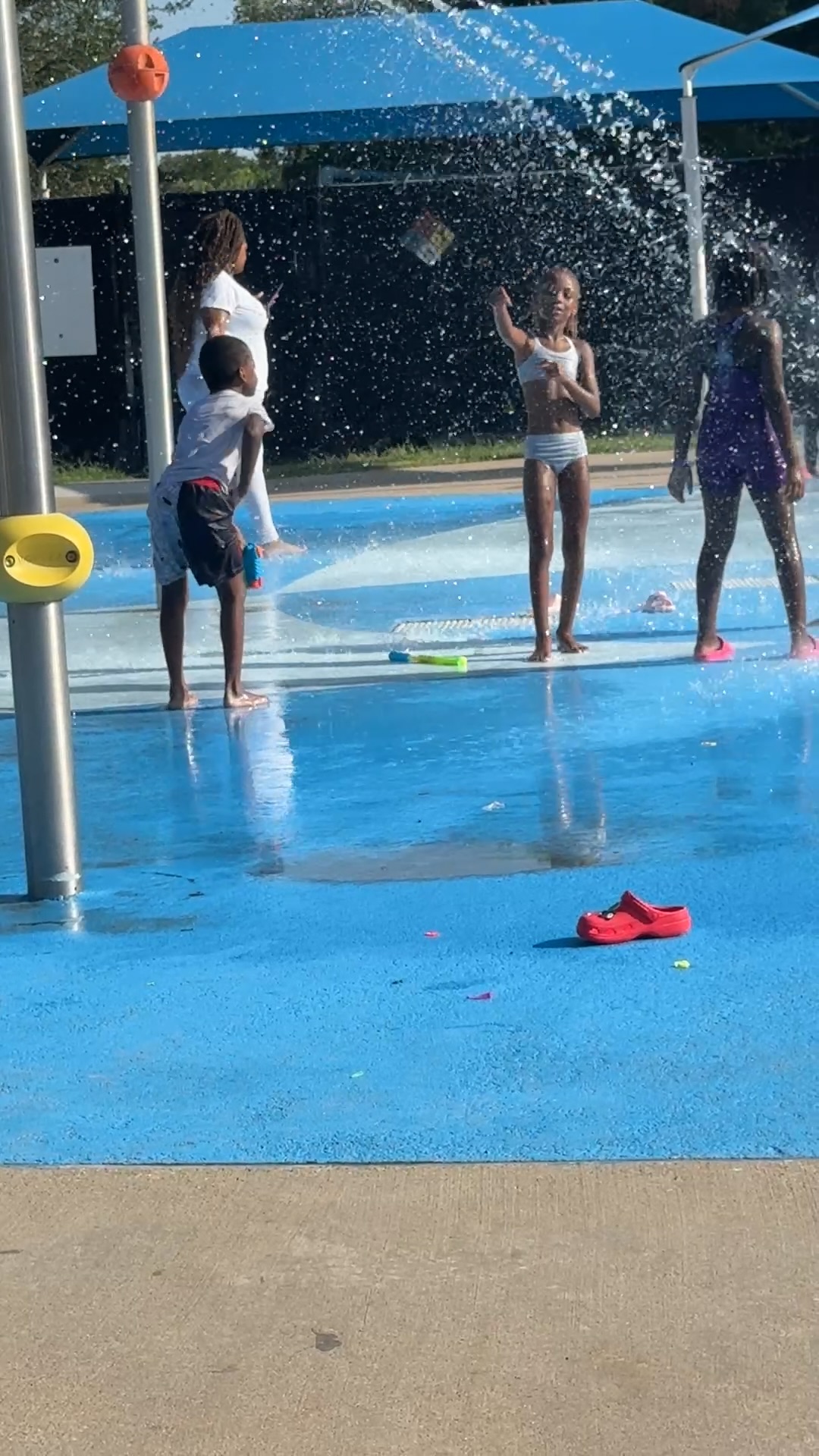 Students playing under the water sprays at Danieldale Park